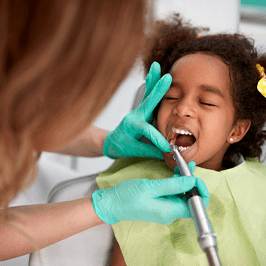 young girl getting a professional dental cleaning