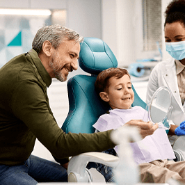 happy young patient getting dental crown in Denver