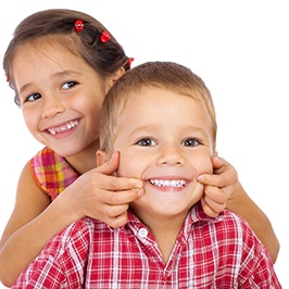 smiling children whose parents take advantage of other options to make care affordable