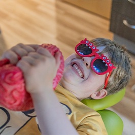 happy child getting a dental examination (for the process section)