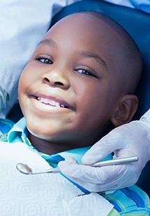 Child smiling at dental checkup