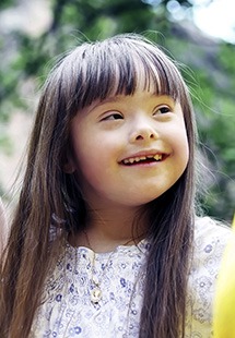 Girl with down syndrome smiling