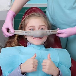 smiling child showing how nitrous oxide sedation works