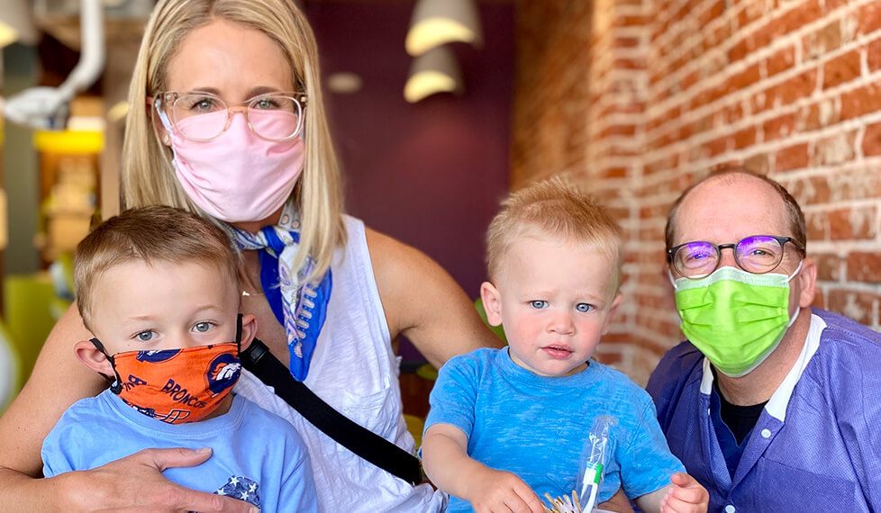 Denver pediatric dentist with two children and their mother