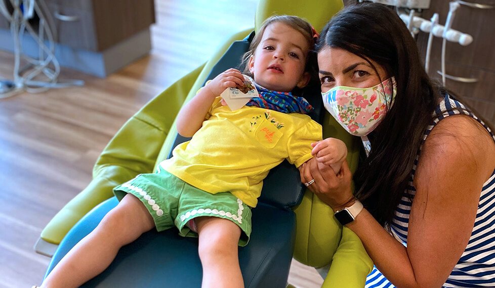 Young girl and her mother in Denver pediatric dental office