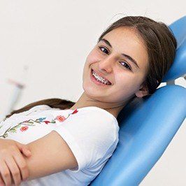 Smiling teen in dental chair