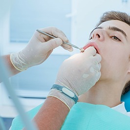 teen boy getting a dental checkup