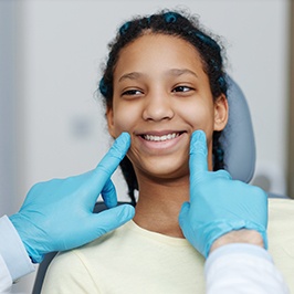 teen girl smiling at the dentist