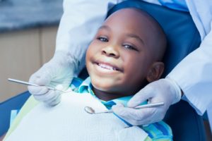 child getting an early dental checkup and cleaning